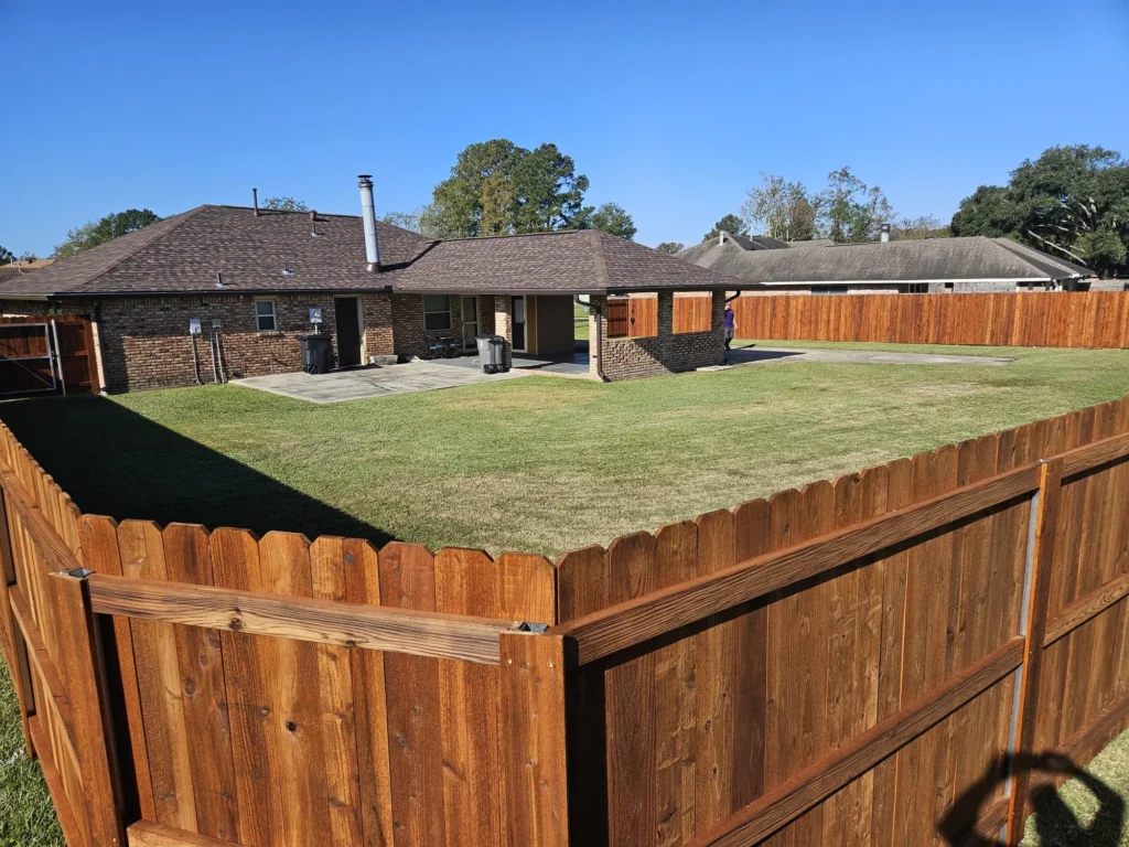 6 foot tall pre stained pecan cedar fence backyard overview