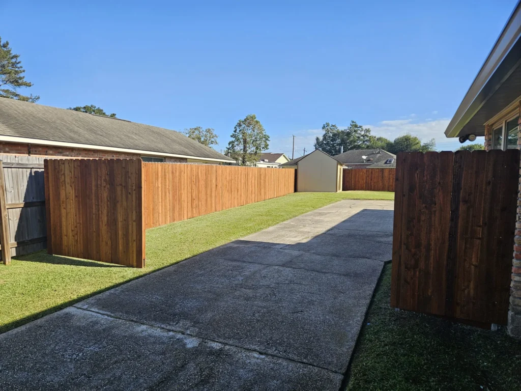 6 foot tall pre stained pecan cedar fence driveway access