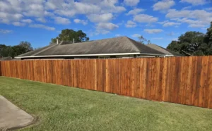 long stained wooden fence