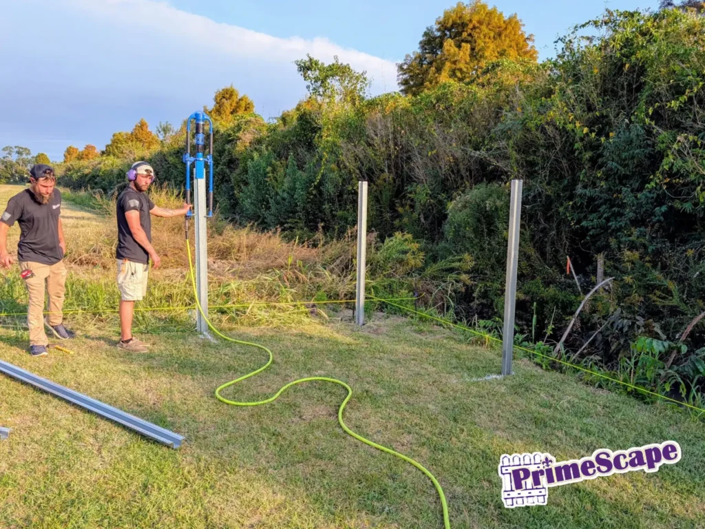 primescape fence employees installing postmaster posts